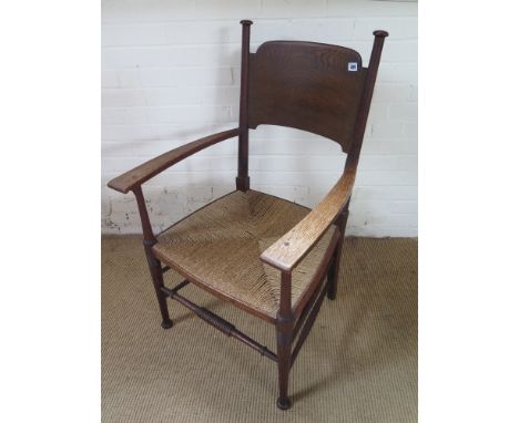An Arts and Crafts William Birch armchair circa 1907, rush seated raised on turned  supports joined by stretchers - Height 61