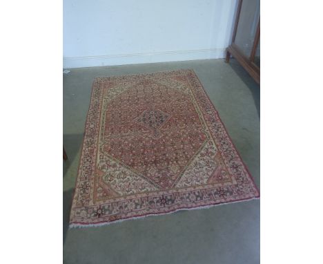 A good Saruk carpet large oval medallion with geometric design with black borders  - 205 cm x 135 cm 