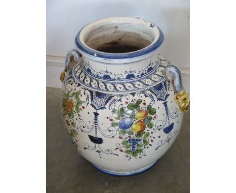 A large decorative garden planter 48cm tall