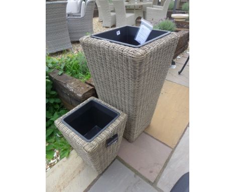 A single rattan tall planter and a smaller planter