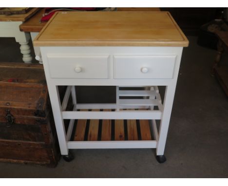 A modern white painted butchers block - board over two drawers with wine rack below above storage shelf