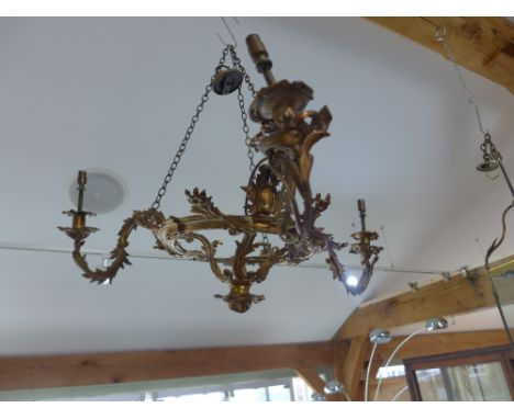 A gilt metal three branch ornate acanthus scroll ceiling light 70cm wide - In need of a clean but appears to be in good order