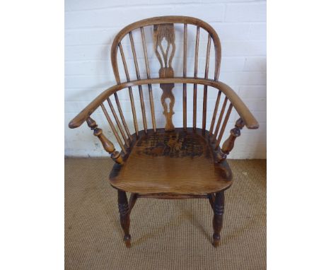 A 19th century ash and elm stick back armchair with a pierced splat on turned legs 