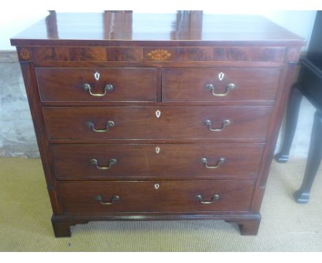 A good quality Georgian mahogany chest with an inlaid frieze with two small blind drawers above five further drawers flanked 