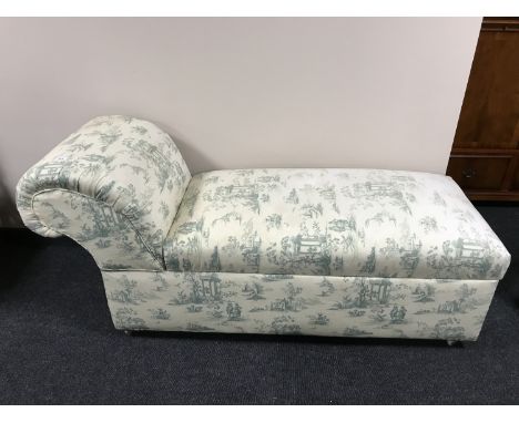 An early 20th century storage chaise longue, on ceramic castors, width 155 cm. 