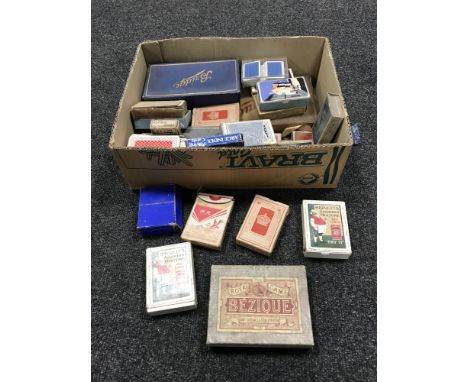 A box of playing cards, bridge sets, Bezique etc 