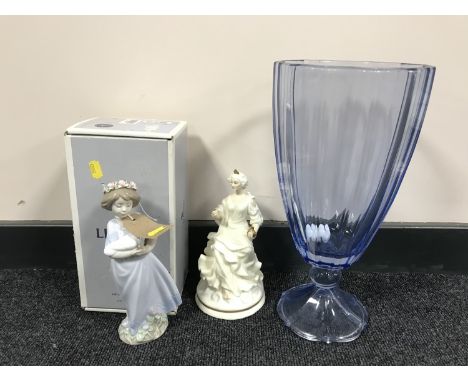 A large decorative blue glass vase, a Nao figure entitled Peaceful and a Royal Doulton figure - The Enchantment Collection Qu