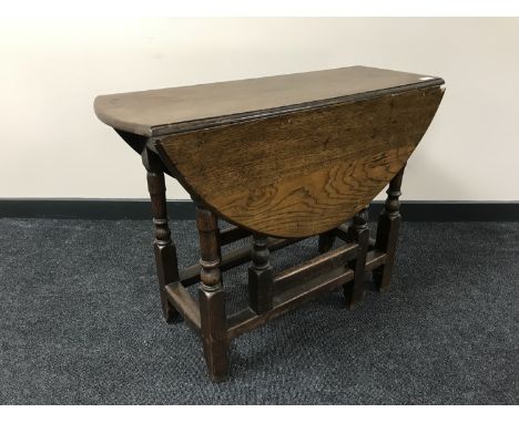 An early 20th century oak gate leg table 