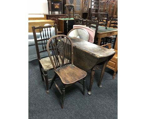 A George III oak gate leg table on pad feet, width 100 cm, together with a rush seated country chair and a single Windsor cha