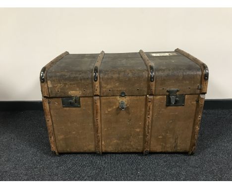 An early 20th century wooden bound trunk 