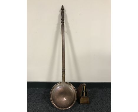 A copper bed warming pan and a French Paquet metronome 