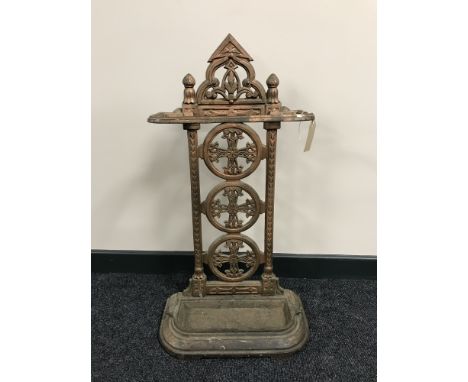 An early 20th century cast iron stick stand with lift out tray 