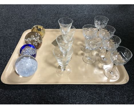 A tray of two sets of glasses and four paperweights including Caithness Congratulations 