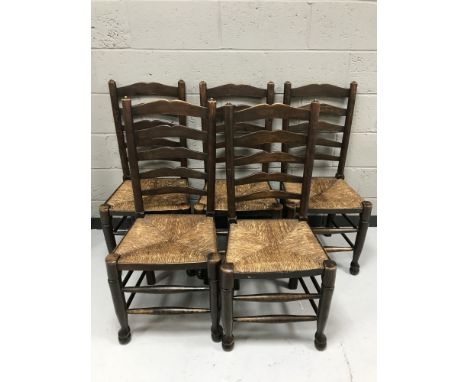 A set of five ladder backed country kitchen chairs 