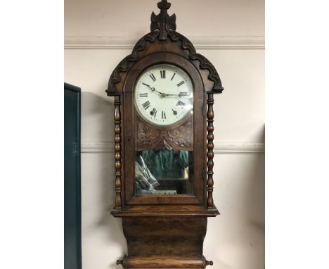 A 19th century walnut cased eight day wall clock 