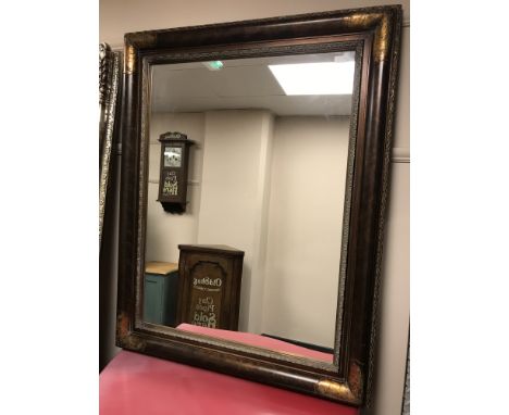 A contemporary overmantel mirror in bronzed frame, 100cm by 125cm