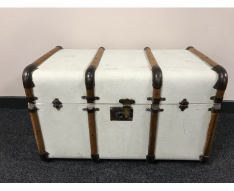 An early 20th century wooden bound trunk 