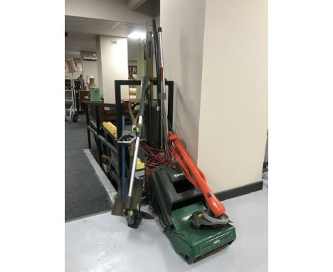 Three bundles of garden tools, set of drain rods, Qualcast mower and a Flymo strimmer 
