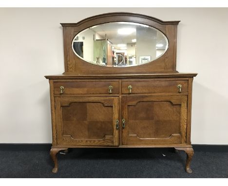 An oak mirror backed sideboard 