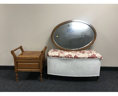 An early 20th century oval framed mirror, commode stool and a blanket box 