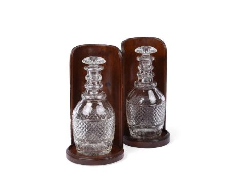 A NEAR PAIR OF REGENCY MAHOGANY BOTTLE STANDS OR WINE SHIELDS CIRCA 1820 Of concave form, same height but different base size