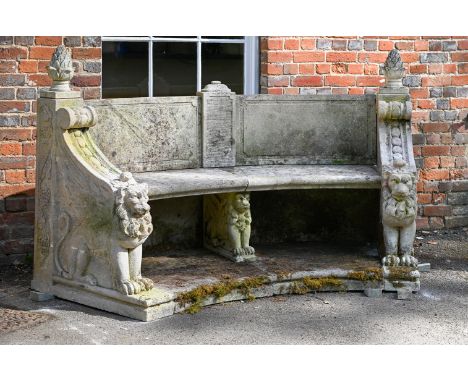 AN ITALIAN CARVED LIMESTONE NEO-CLASSICAL BENCH MID/LATE 20TH CENTURY Semi-circular back within boldly carved winged lion end