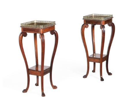 Y A PAIR OF REGENCY ROSEWOOD AND GILT METAL MOUNTED TWO TIER PEDESTALS OR ETAGERESIN THE MANNER OF GEORGE OAKLEY, CIRCA 1815-