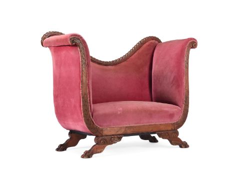 A CARVED 'RED WALNUT' AND UPHOLSTERED SOFA 19TH CENTURY Of exaggerated swept form 155cm wide, 144cm high, 62cm deep 