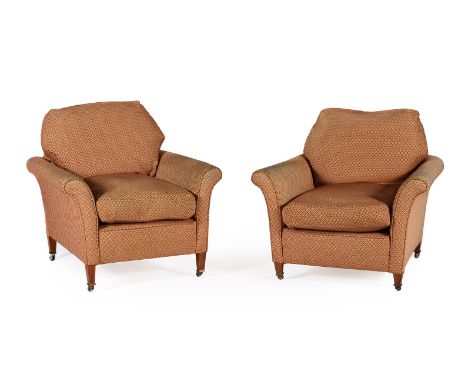 A MATCHED PAIR OF EDWARDIAN WALNUT AND UPHOLSTERED ARMCHAIRS BY HOWARD AND SONS, EARLY 20TH CENTURY All castors stamped 'HOWA