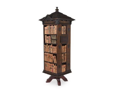 AN OAK TABARD INN LIBRARY BOOKCASE  IN THE MANNER OF RICHARD NORMAN SHAW, CIRCA 1890  The architectural pediment inscribed 'T