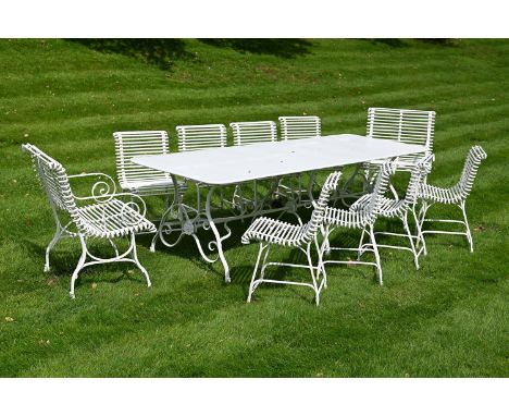 A HAND FORGED WHITE PAINTED IRON GARDEN OR ARRAS SUITE MODERN Comprising a large rectangular dining table, with set of 10 rib