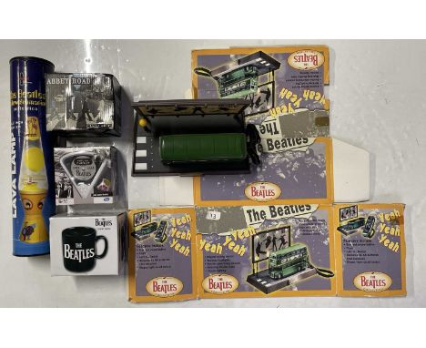 An original 1998 'Beatles Collection' Apple licensed novelty telephone in the shape of a Routemaster bus. Original box is pre