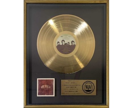 An official RIAA gold disc award, presented c 1977 to former Senior Vice President of Promotions for Capitol Records Bruce We