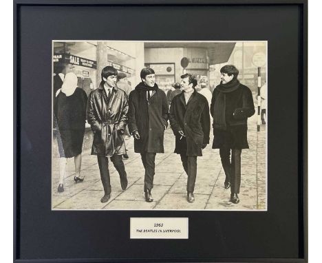 An original vintage print of an image depicting The Beatles on Ranelagh St. Liverpool in January 1963. Measures 23.4 x 18.6cm