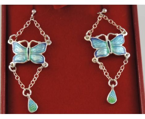 A pair of silver and enamel set drop earrings. 