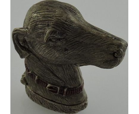 A silver plated and enamel set vesta case in the form of a dog.