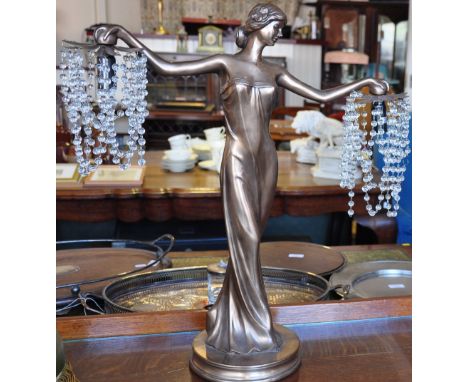 An Art Deco-style lamp in the form of a lady. 