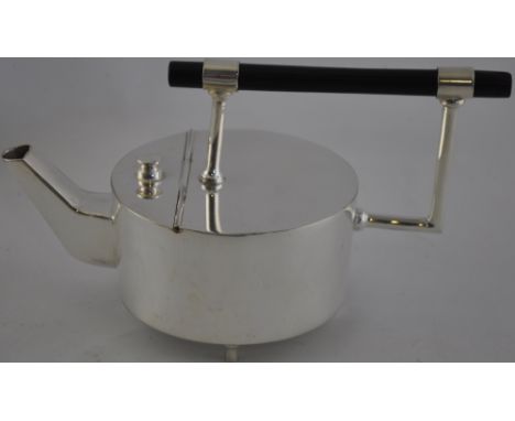 A silver plated Christopher Dresser-style teapot.