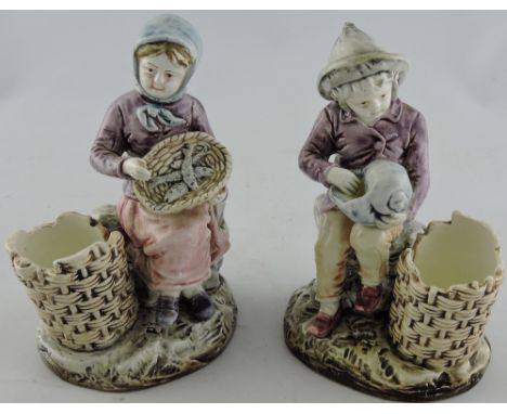 A glazed ceramic figure of a fish seller, together with a similar figure of a child