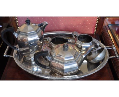 A silverplated four piece tea service together with a ladle and a galleried tea tray