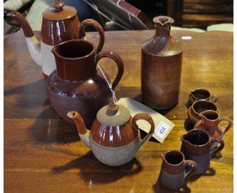 A group of Victorian saltglazed and glazed pottery including ink jars, harvest jugs, teapot etc