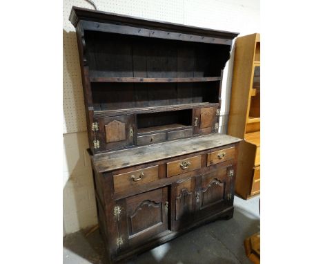 An 18th Century & Later North Wales Dresser, Having A Two Shelf Rack With Side Cupboards & Spice Drawers, The Base With Cupbo