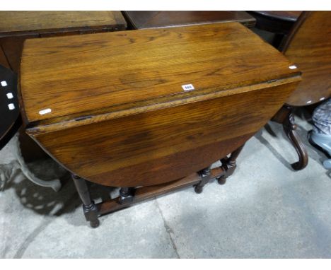 An Early 20th Century Polished Oak Gate Leg Table                               