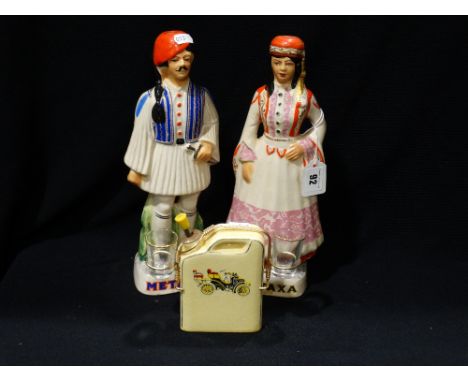 A Pair Of Mid 20th Century Metaxa Decanters In The Form Of Greek Figures, Together With A Novelty Vintage Car Theme Decanter 