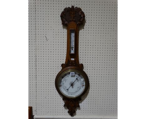 An Edwardian Oak Framed Wall Barometer With Circular Dial                       