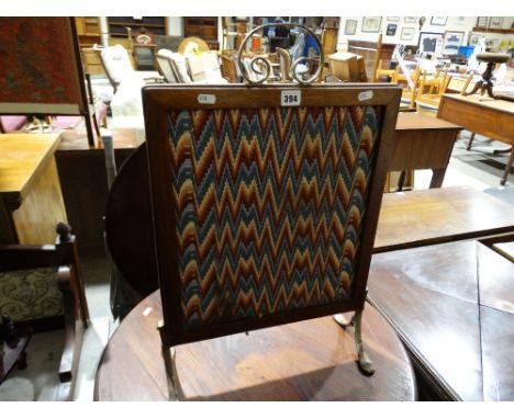 A Metal Framed Woolwork Fire Screen                                             