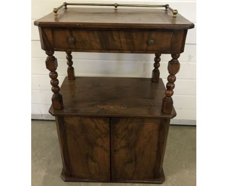 A vintage 2 door hall cabinet with inlaid detail. Upper shelf has central drawer and brass rail back  Approx. 59cm wide x 88c