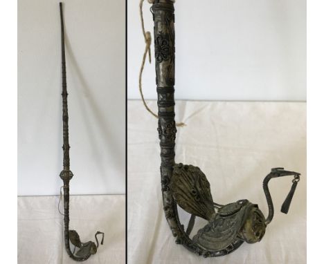 A vintage oriental opium pipe with peacock shaped bowl and filigree art work with floral designs.  Approx. 69cm long.