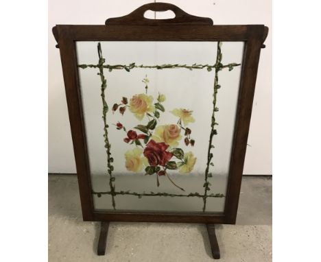 A vintage wooden framed firescreen with hand painted glass panel.  Approx. 72cm tall.
