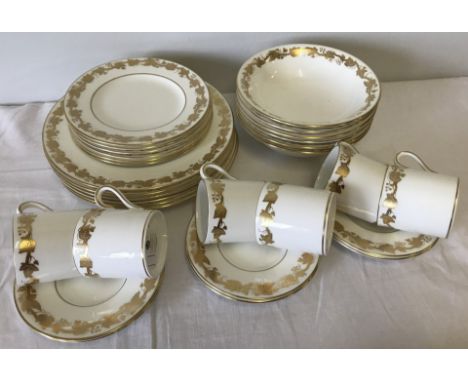 Wedgwood "Whitehall" design coffee set with gilt vine leaf decoration. Comprising; 6 coffee cans & saucers, 6 cake plates, 6 